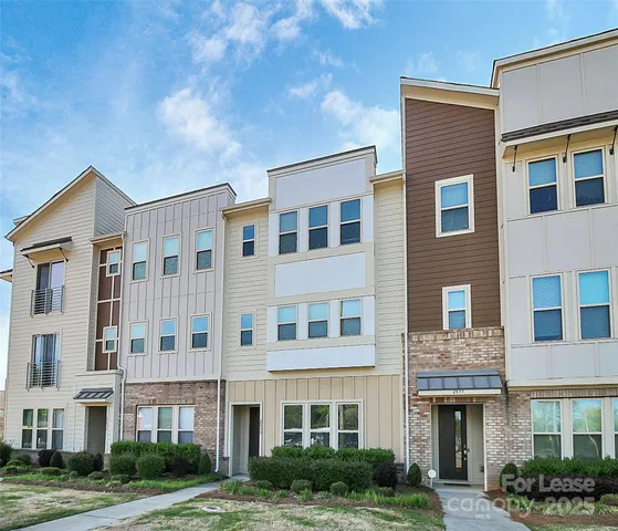a front view of a building with garden