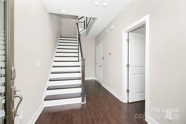 a view of entryway with wooden floor