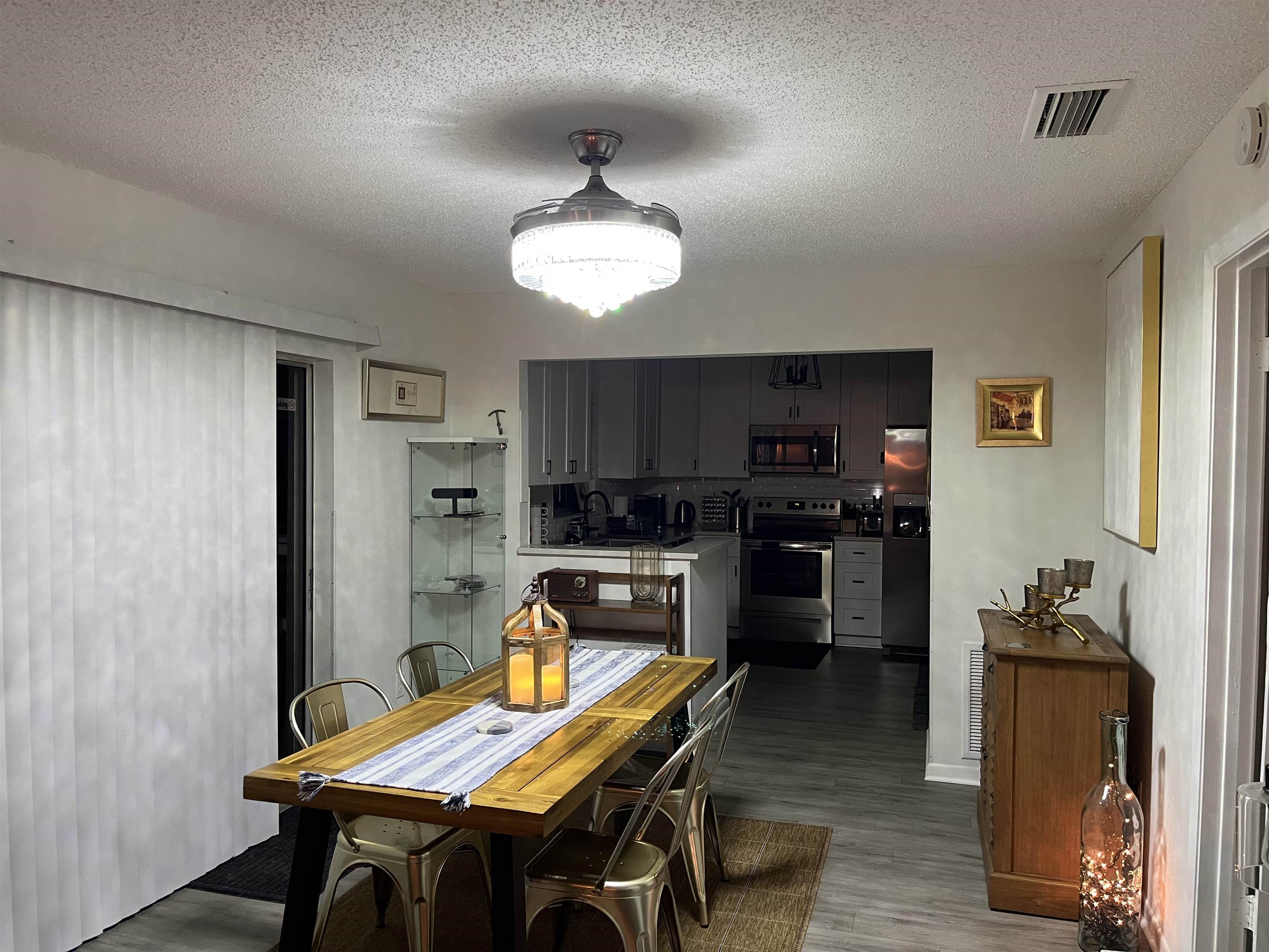1010 San Remo Road St. Augustine, FL 32086 - Photo 20 of 67 a view of a dining room with furniture and wooden floor