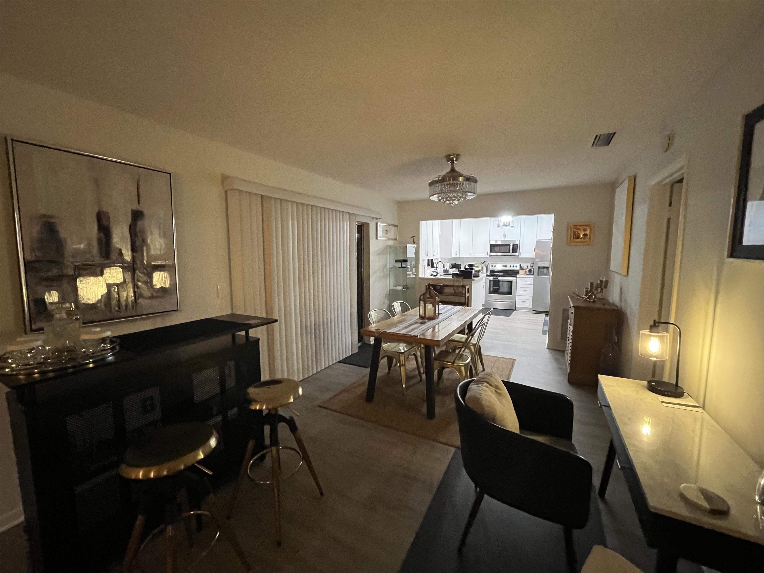 1010 San Remo Road St. Augustine, FL 32086 - Photo 21 of 67 a view of a dining room with furniture and chandelier