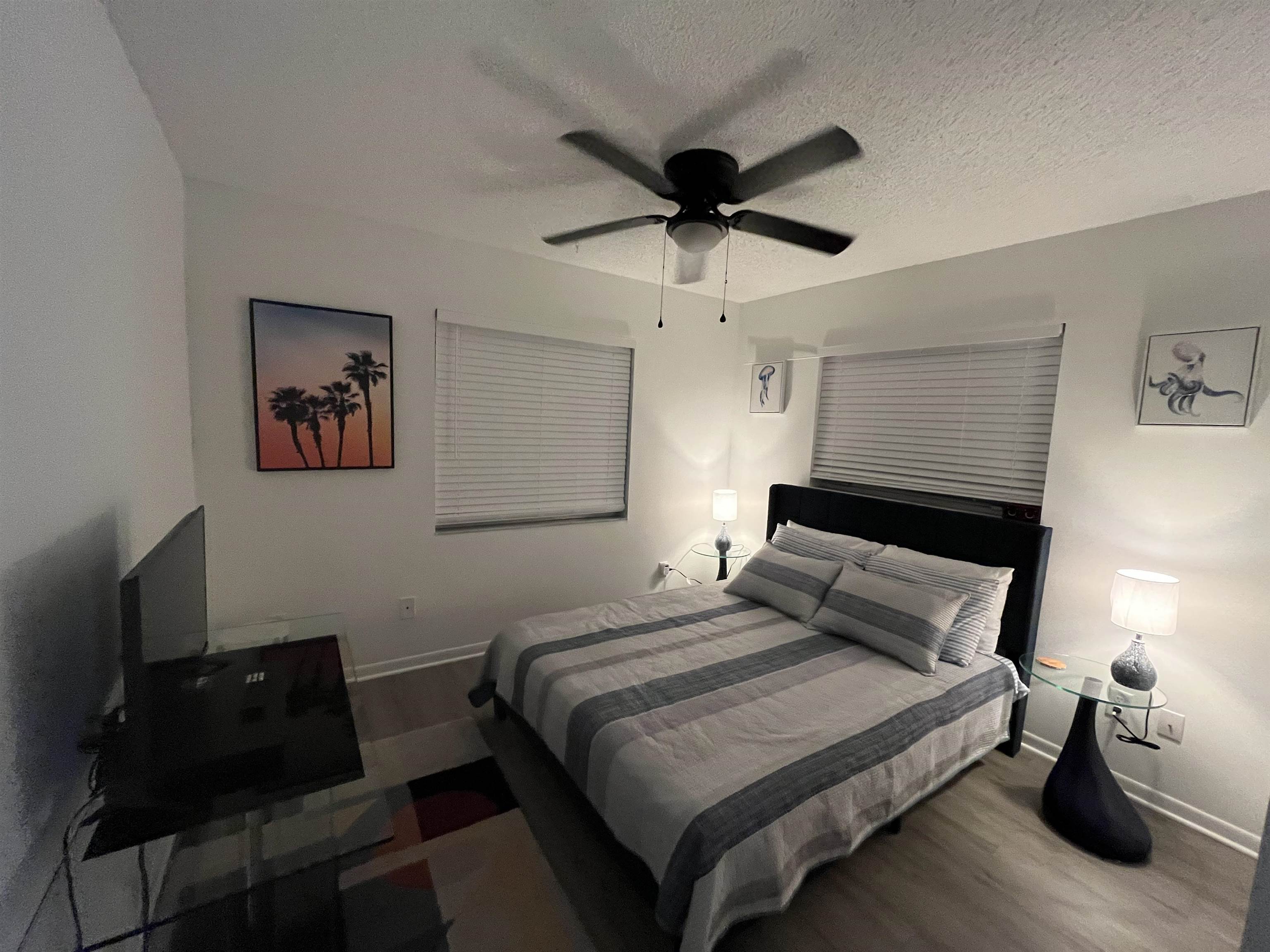 1010 San Remo Road St. Augustine, FL 32086 - Photo 27 of 67 a bedroom with a bed and a chandelier