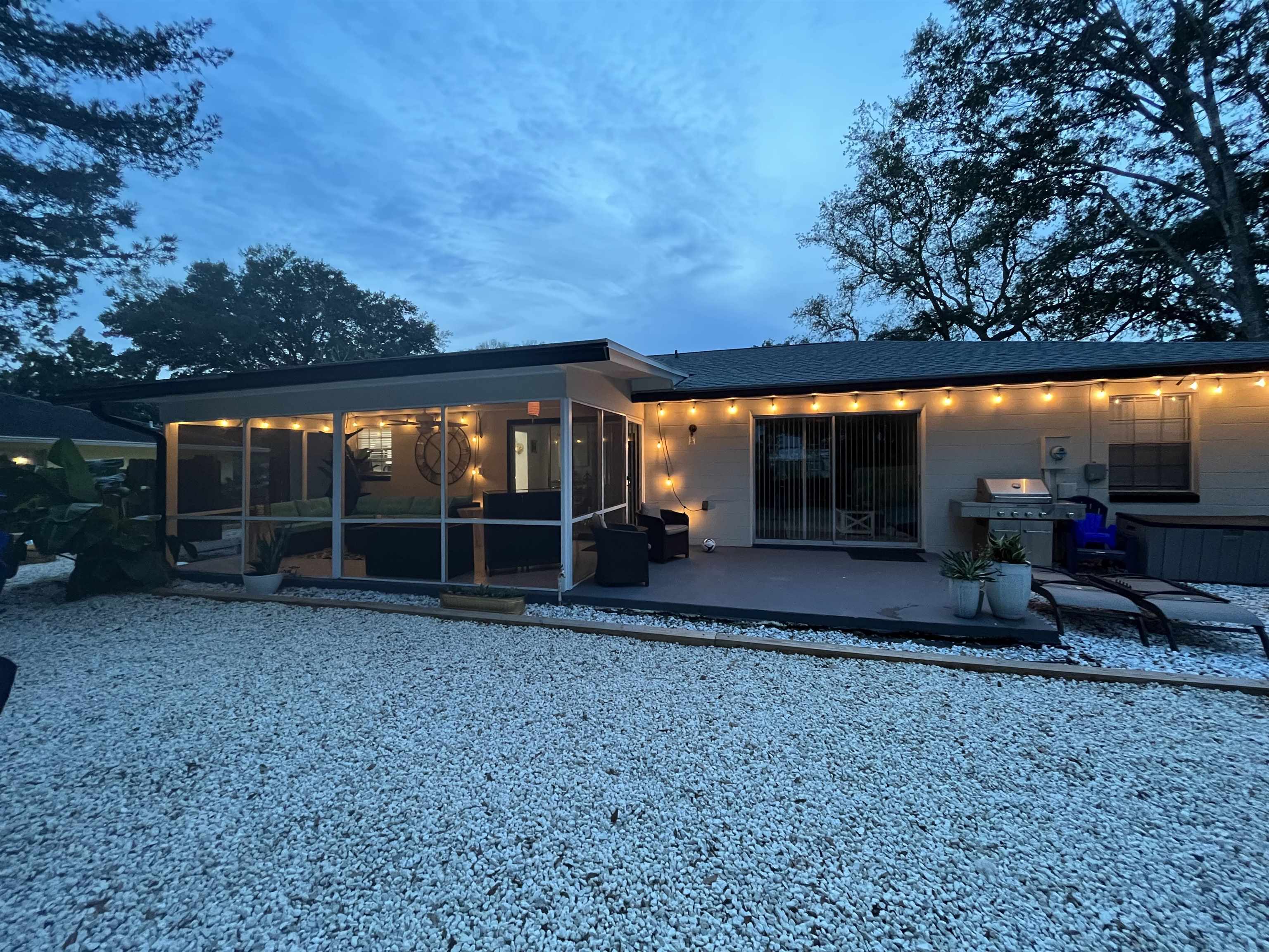 1010 San Remo Road St. Augustine, FL 32086 - Photo 31 of 67 Back of property with a patio and a sunroom