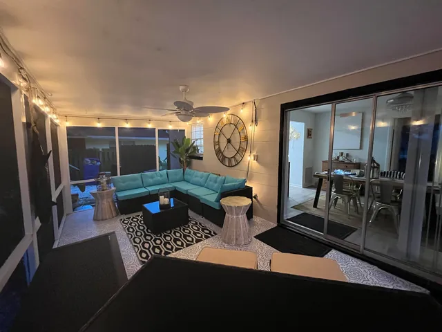 a backyard of a house with table and chairs