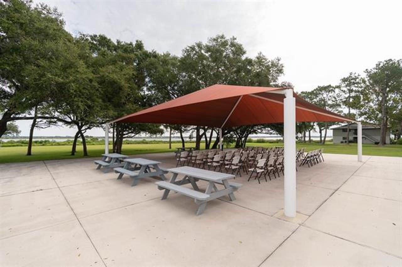 1010 San Remo Road St. Augustine, FL 32086 - Photo 39 of 67 a backyard of a house with table and chairs
