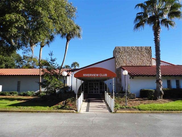 1010 San Remo Road St. Augustine, FL 32086 - Photo 43 of 67 a view of a table and chairs under an umbrella