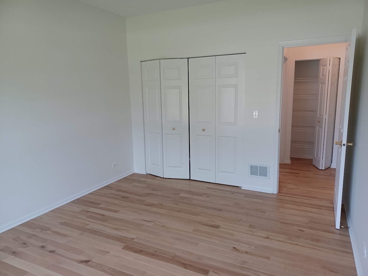 24463 Tufton Street Plainfield, IL 60585 - Photo 13 of 29 a view of an empty room with wooden floor