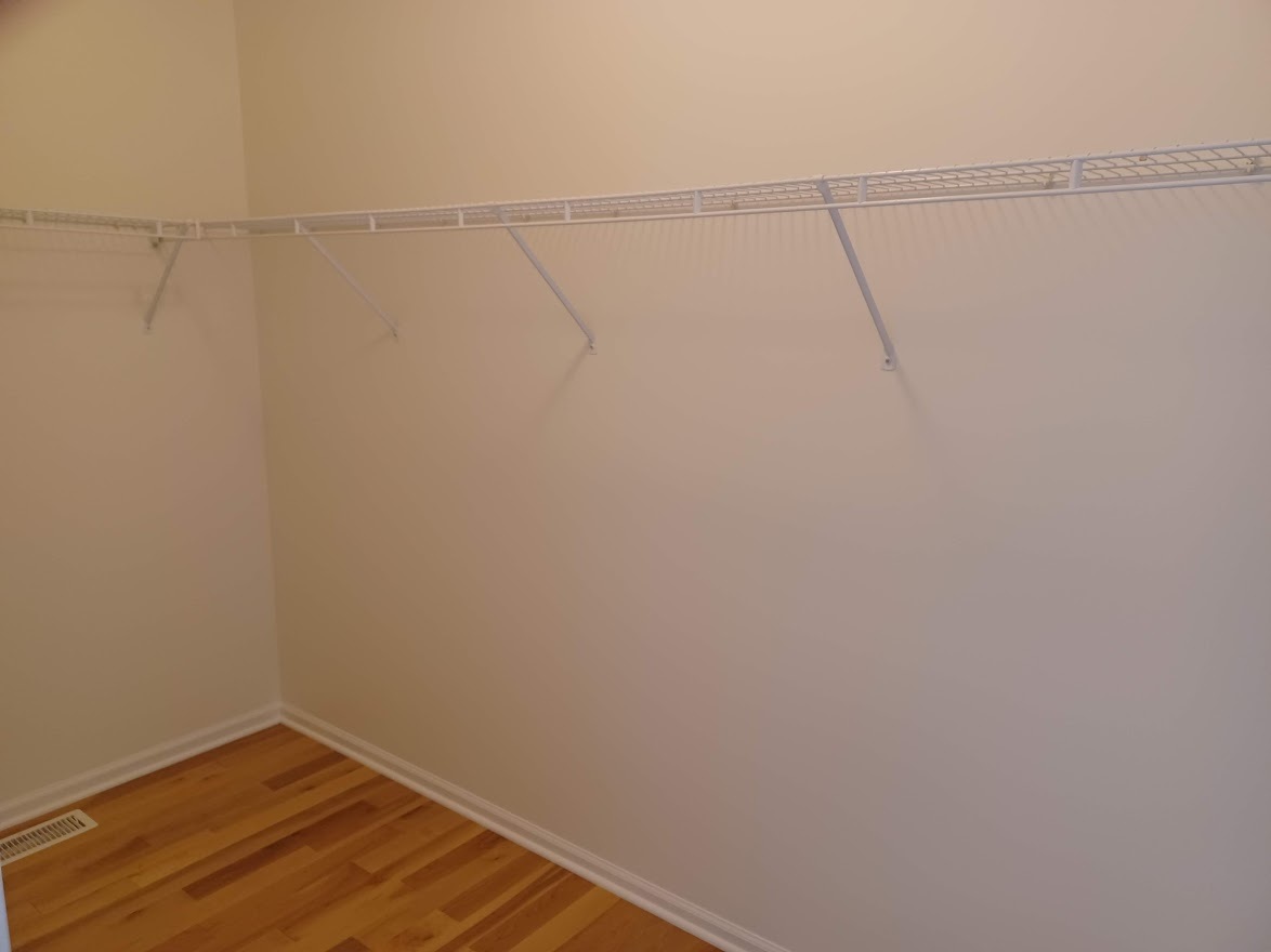 24463 Tufton Street Plainfield, IL 60585 - Photo 16 of 29 a view of a room with racks on the wall
