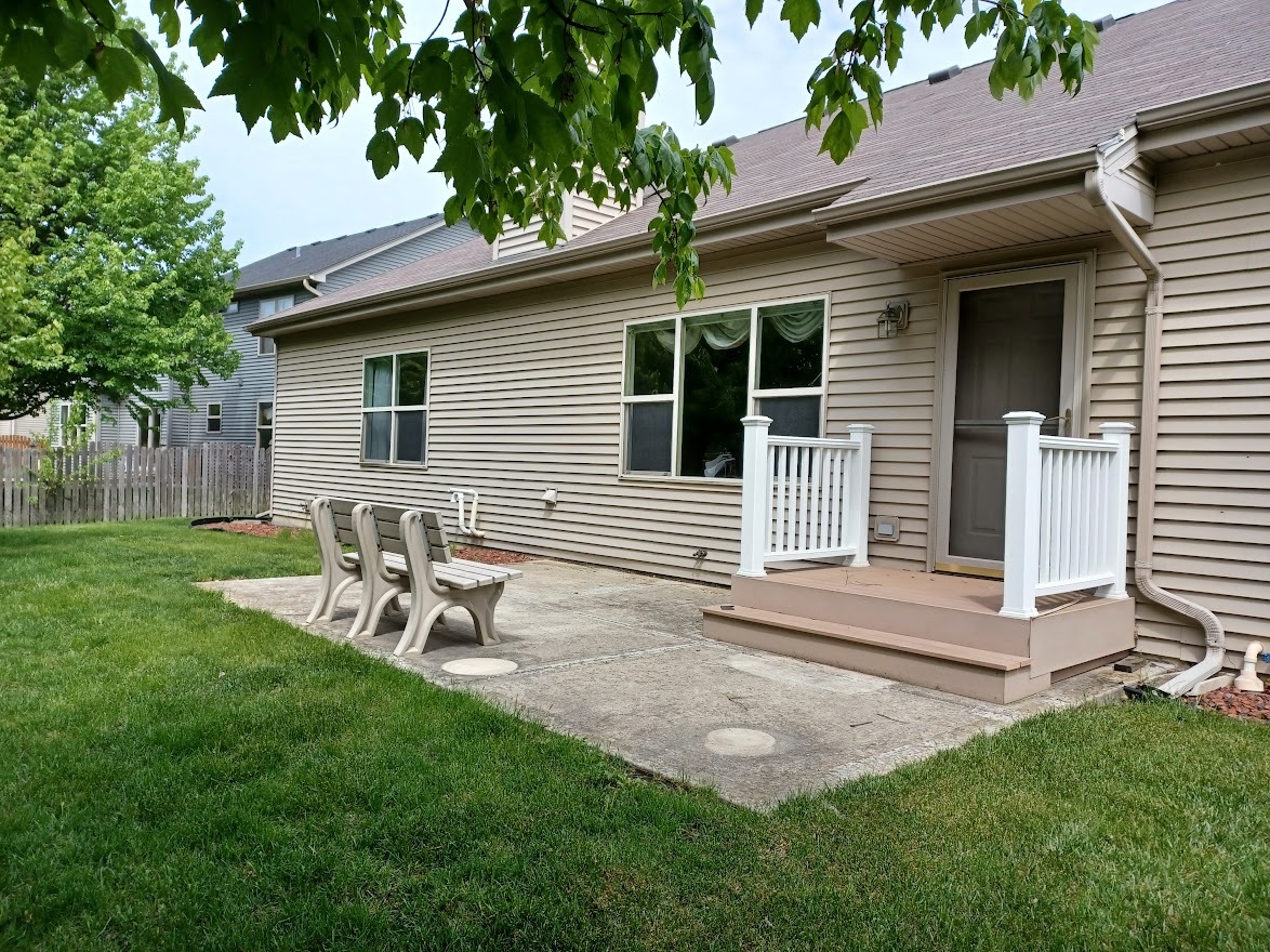 24463 Tufton Street Plainfield, IL 60585 - Photo 25 of 29 a view of a chair and table in backyard of the house