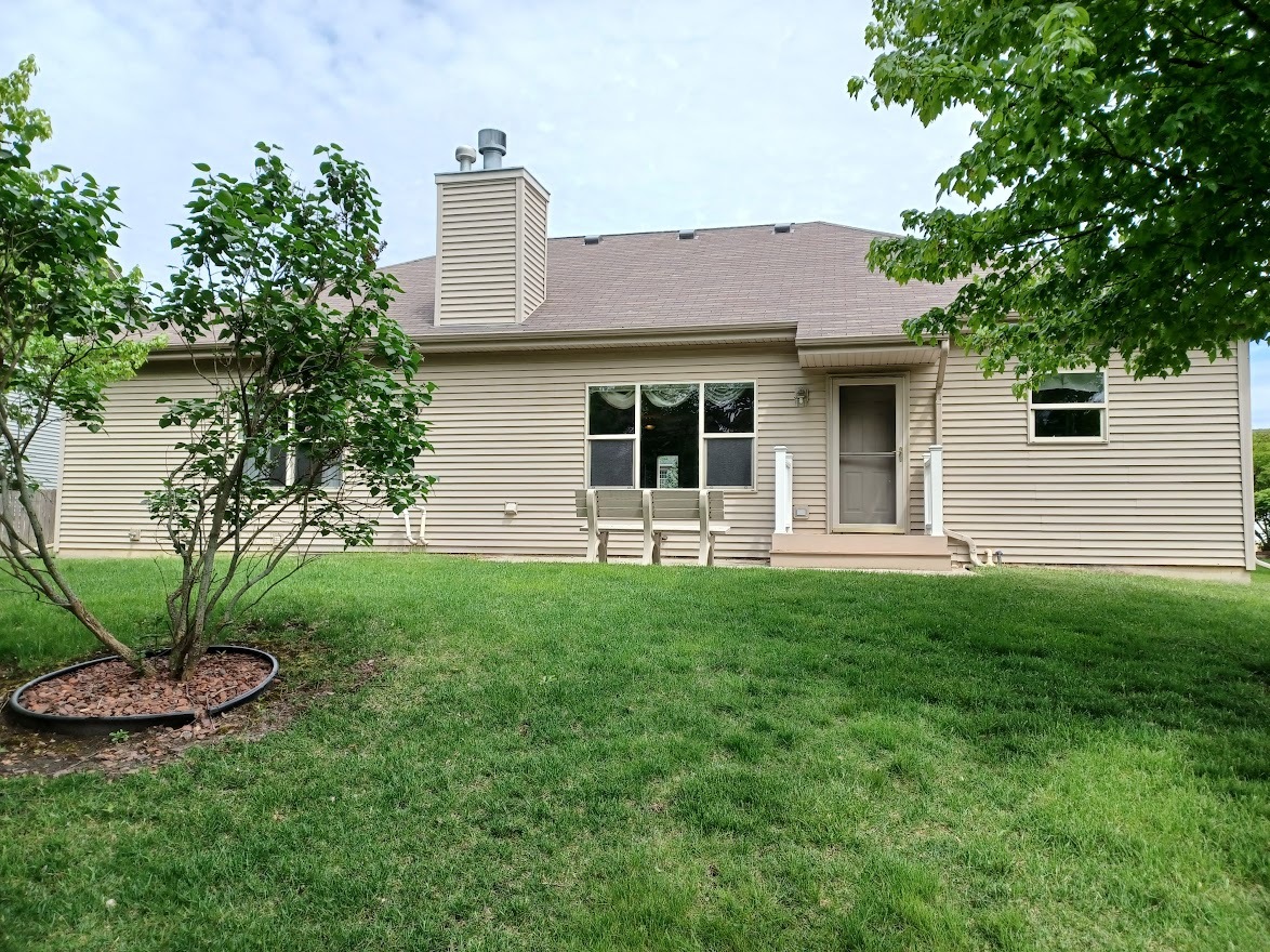 24463 Tufton Street Plainfield, IL 60585 - Photo 28 of 29 a front view of a house with a yard
