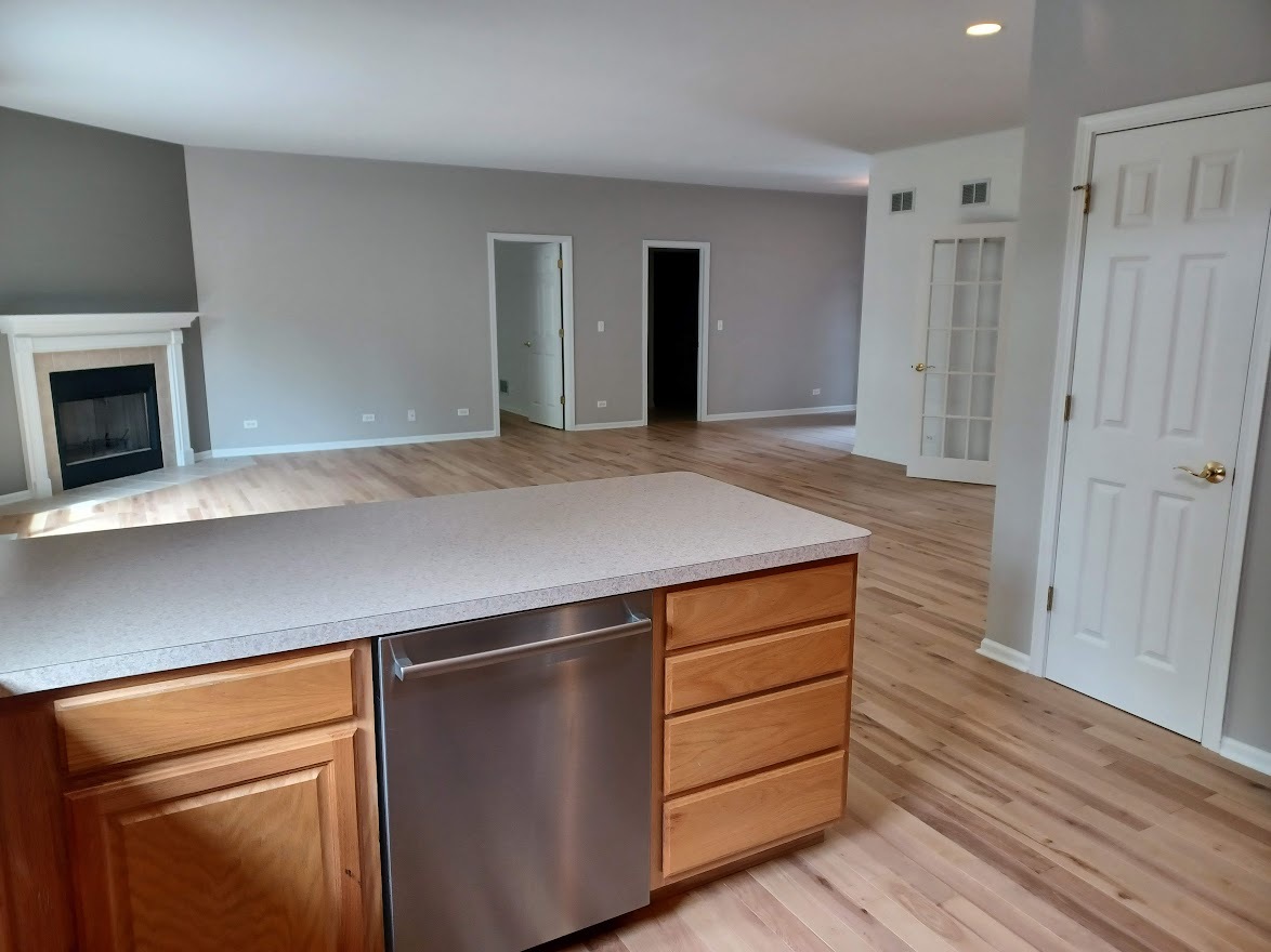 24463 Tufton Street Plainfield, IL 60585 - Photo 9 of 29 a kitchen with cabinets and wooden floor