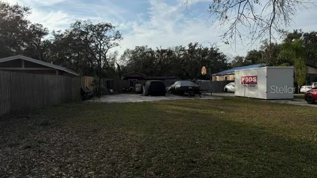 a view of outdoor space with deck and yard