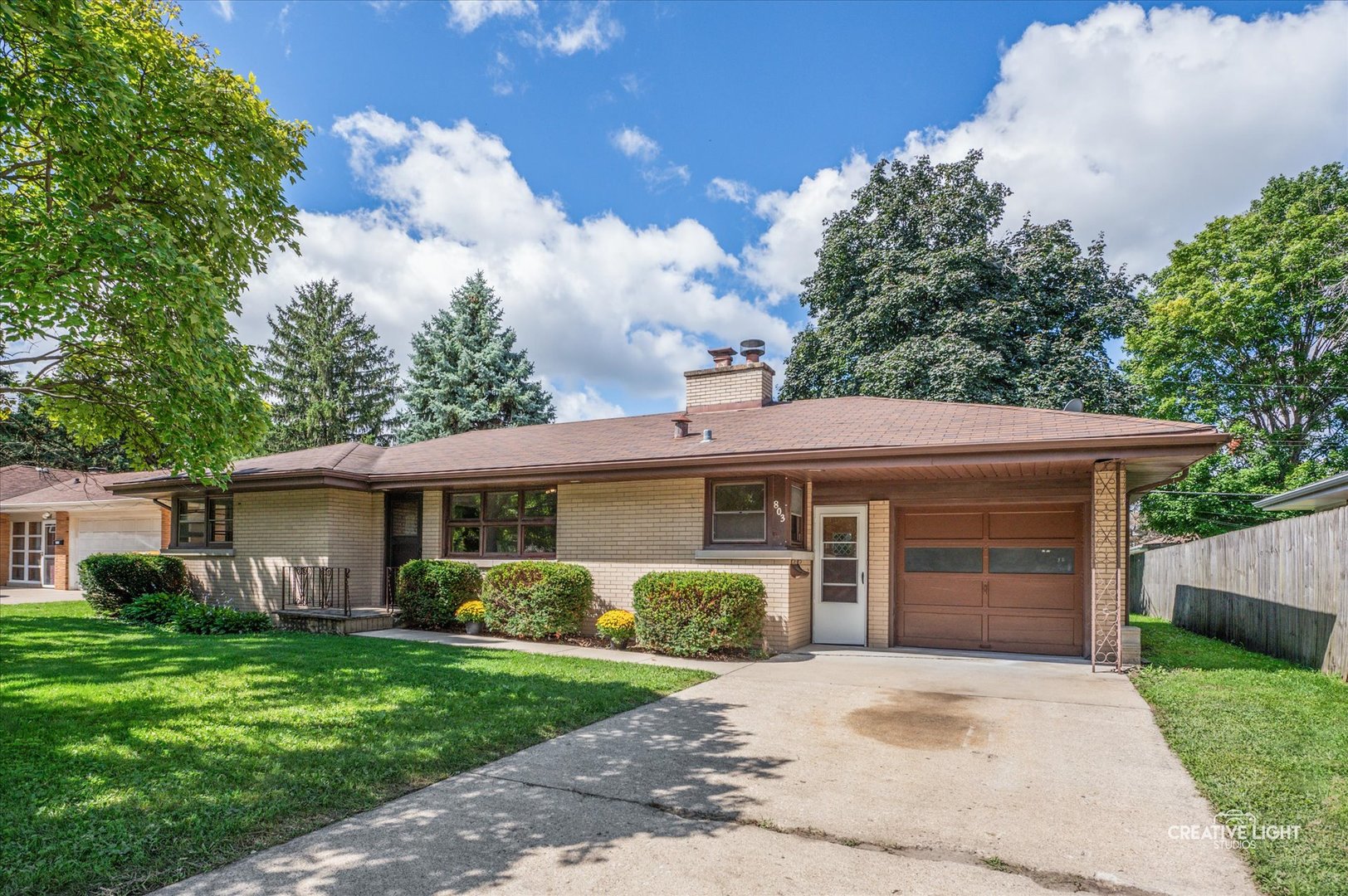803 Alann Drive Joliet, IL 60435 - Photo 1 of 15 a front view of a house with a garden and plants
