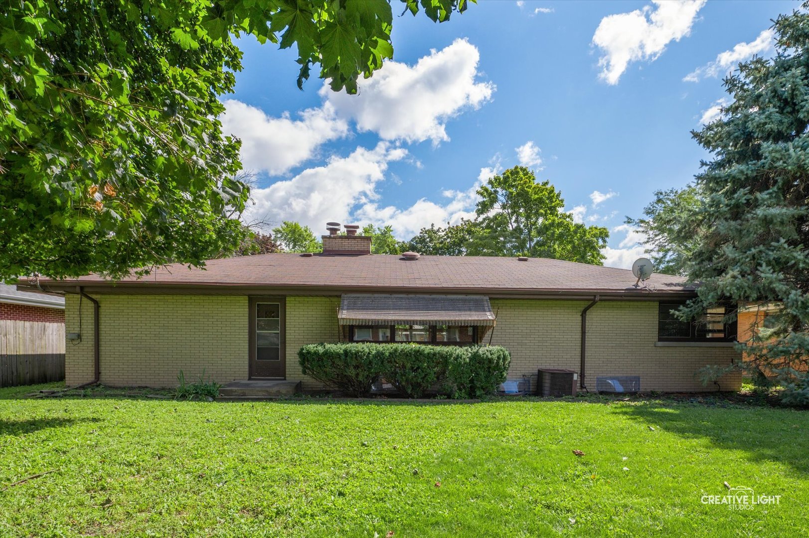 803 Alann Drive Joliet, IL 60435 - Photo 13 of 15 a front view of a house with garden