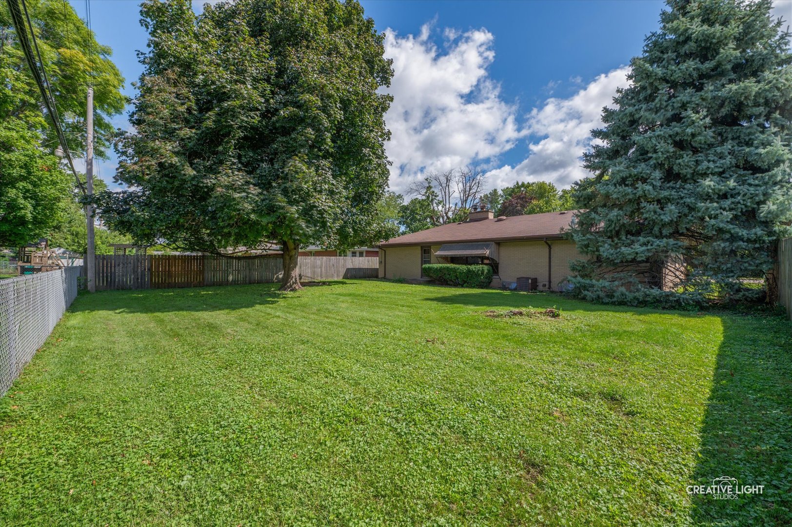 803 Alann Drive Joliet, IL 60435 - Photo 14 of 15 a front view of house with a garden