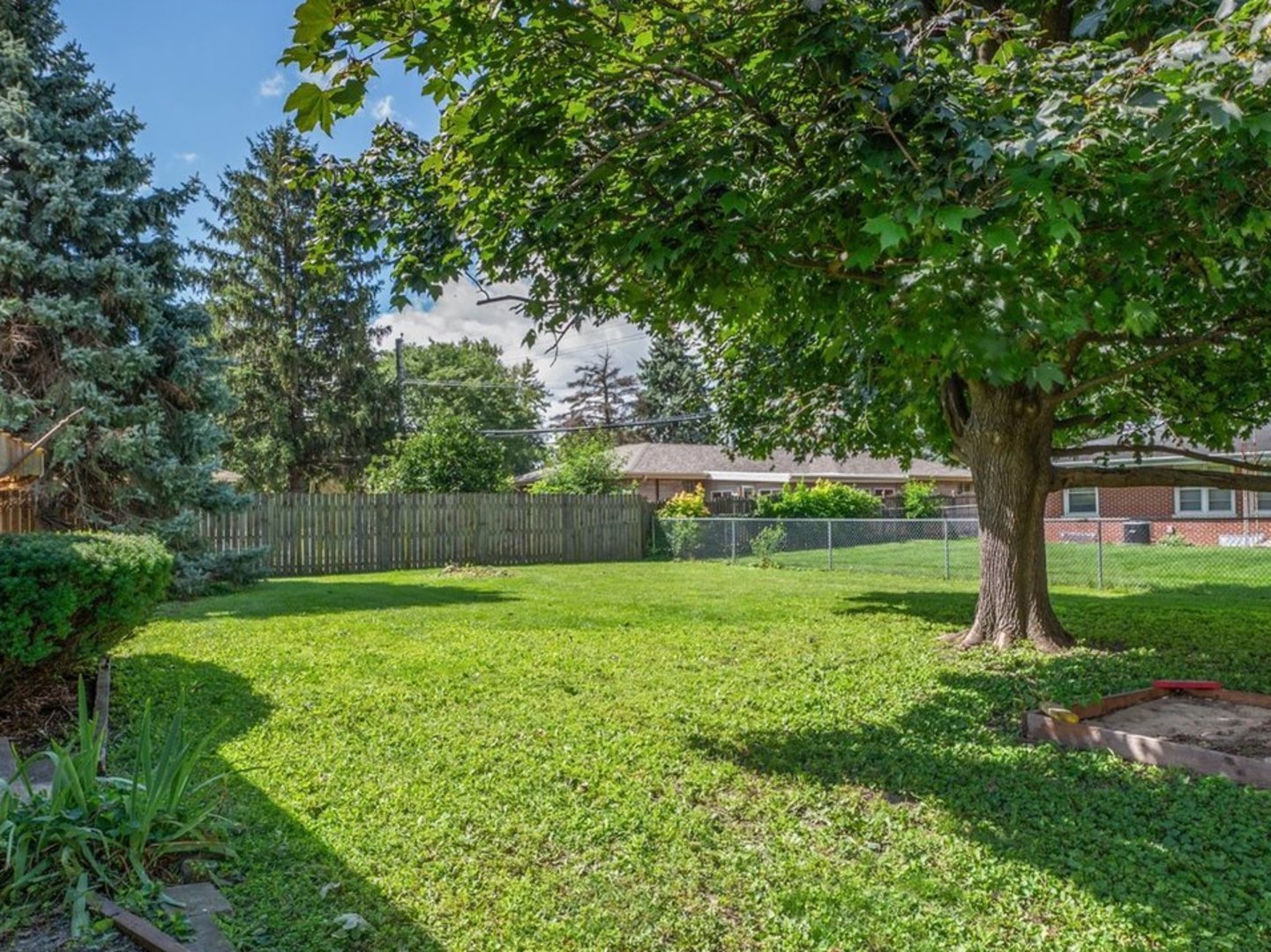 803 Alann Drive Joliet, IL 60435 - Photo 15 of 15 a view of a garden with a tree