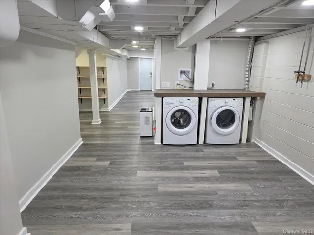 a view of a storage & utility room with washer and dryer