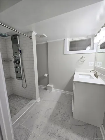 a bathroom with a sink and mirror