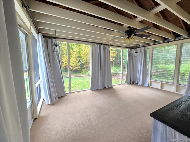 a view of a room with a large window