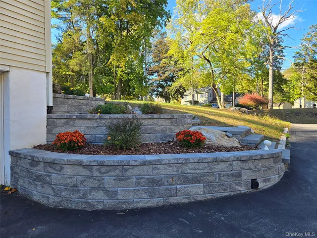 a view of a tiny house with a yard