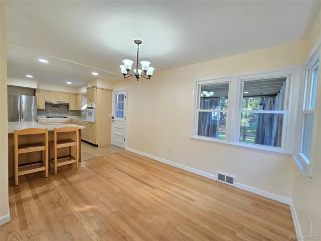 a view of a kitchen with furniture and a kitchen