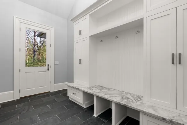 a view of room with window and hallway