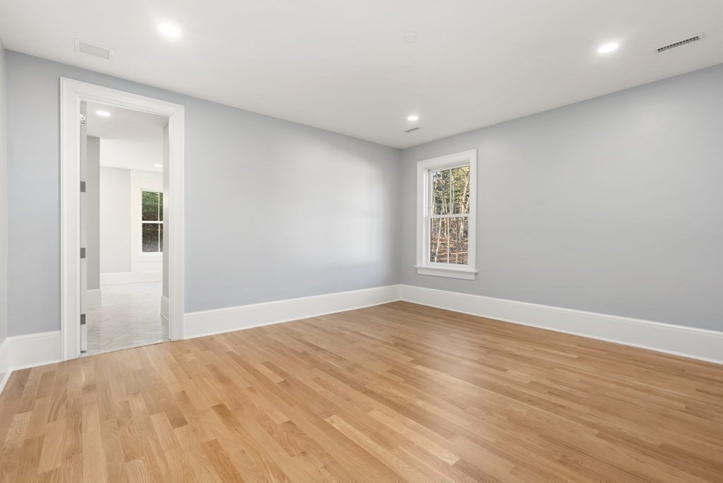 192 Pond Road Wellesley, MA 02482 - Photo 18 of 41 a view of empty room with wooden floor and fan