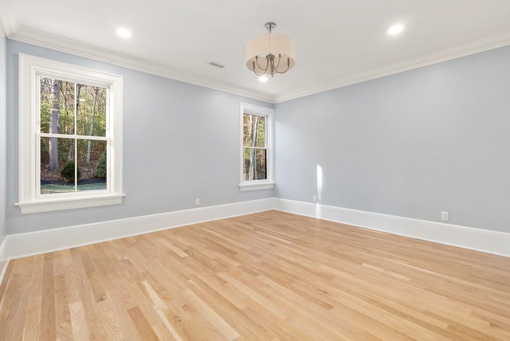 192 Pond Road Wellesley, MA 02482 - Photo 23 of 41 a view of an empty room with wooden floor and a window