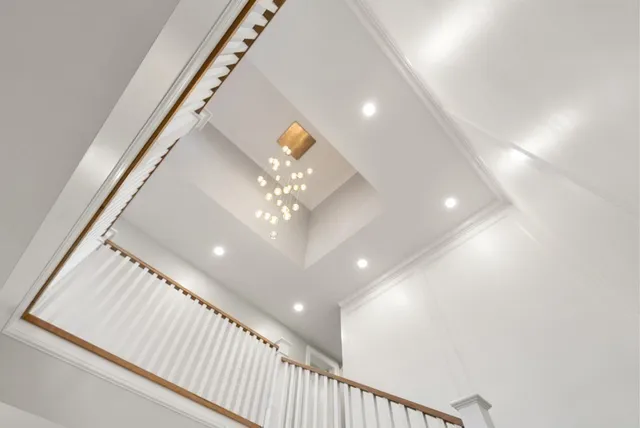 a view of a room with wooden floor