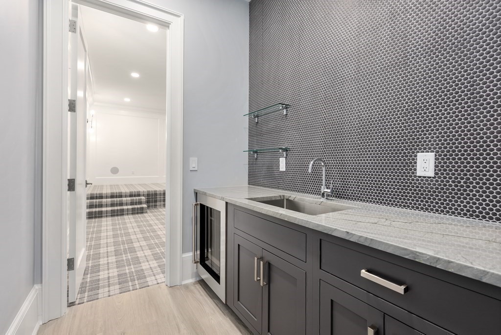 192 Pond Road Wellesley, MA 02482 - Photo 30 of 41 a bathroom with a sink a toilet and shower