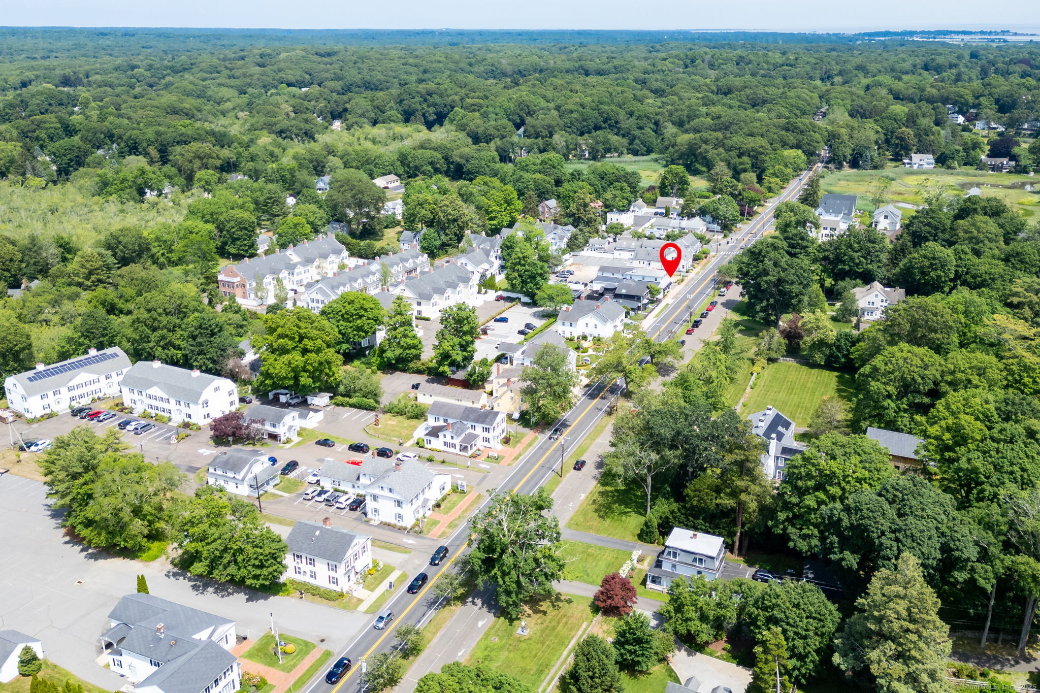 885 Boston Post Road Madison, CT 06443 - Photo 22 of 22 an aerial view of residential houses with outdoor space and trees all around