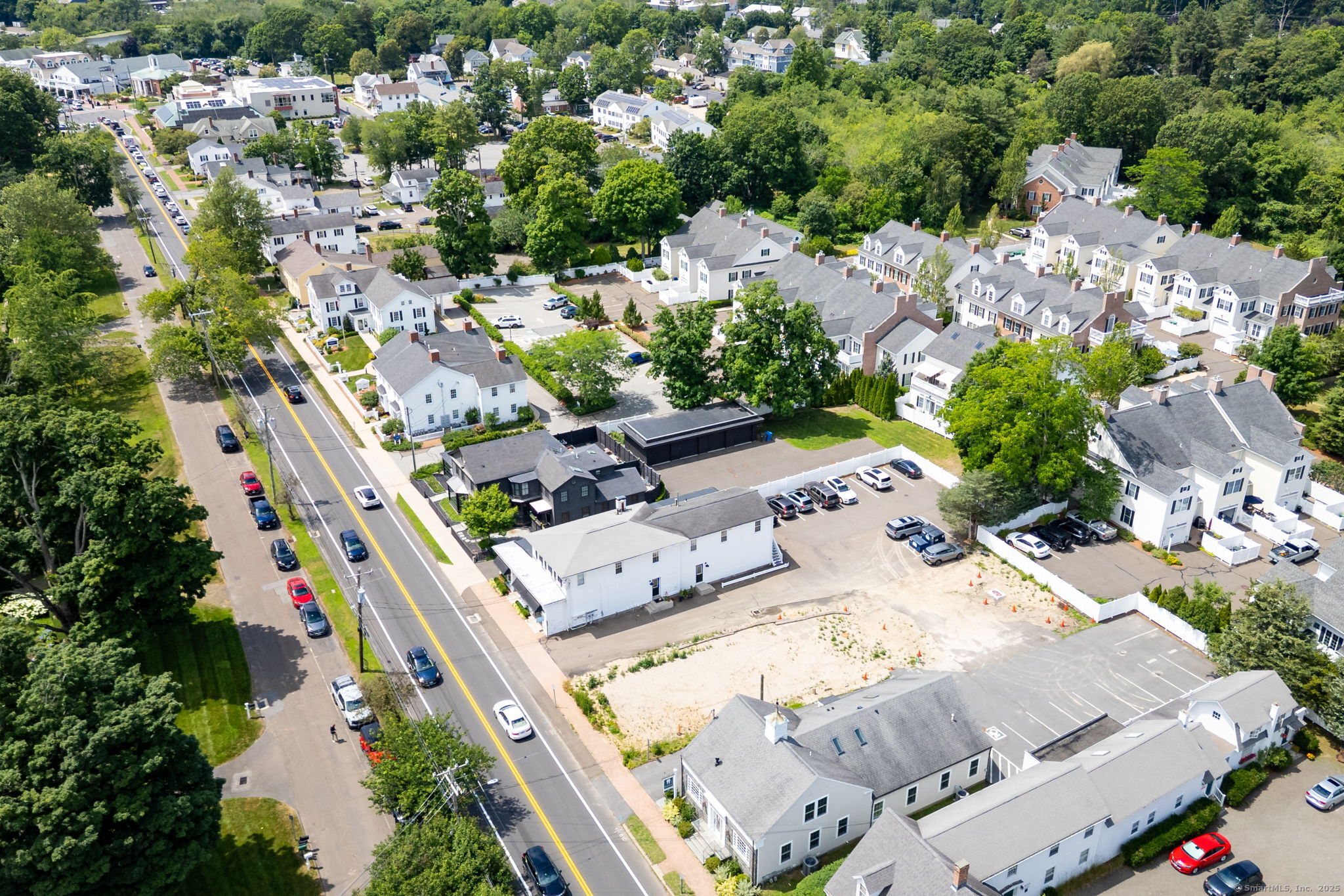 885 Boston Post Road Madison, CT 06443 - Photo 4 of 22 an aerial view of a house with a yard basket ball court and outdoor seating