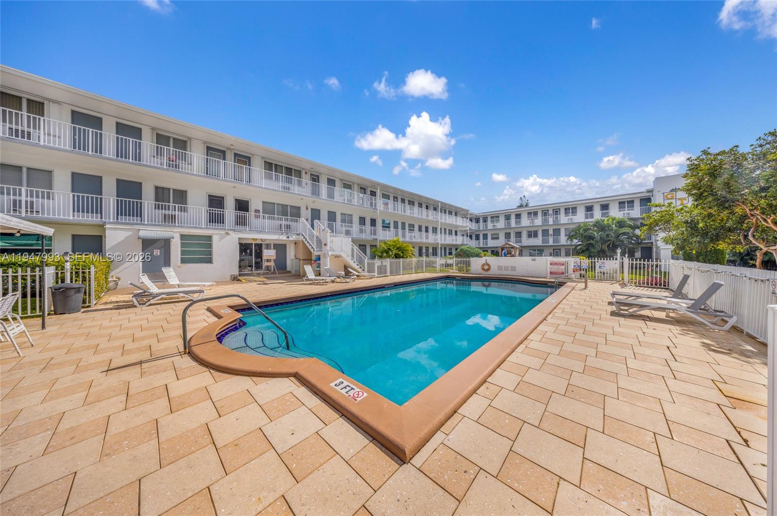 15610 Northeast 6th Avenue, Unit 9B Miami, FL 33162 - Photo 21 of 25 a view of an chairs and tables in the patio