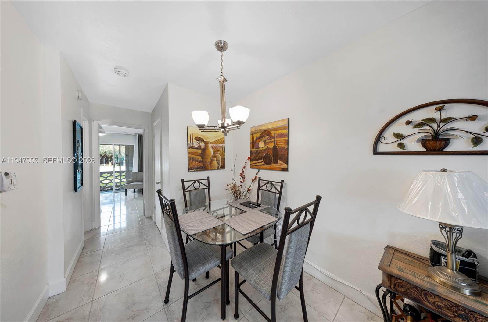 15610 Northeast 6th Avenue, Unit 9B Miami, FL 33162 - Photo 5 of 25 a view of a dining room with furniture