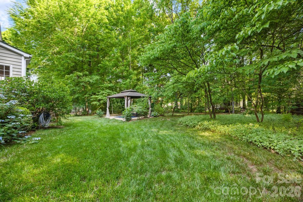 17028 Hampton Trace Road Huntersville, NC 28078 - Photo 35 of 41 a view of a house with a backyard