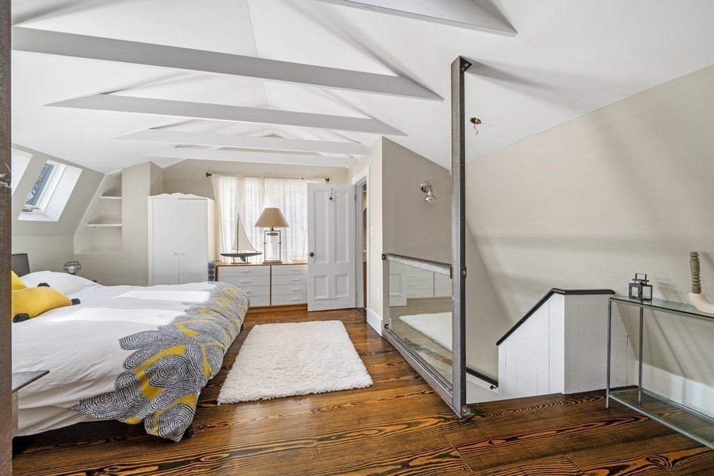 3 State Street Marblehead, MA 01945 - Photo 20 of 33 a bedroom with a bed and wooden floor