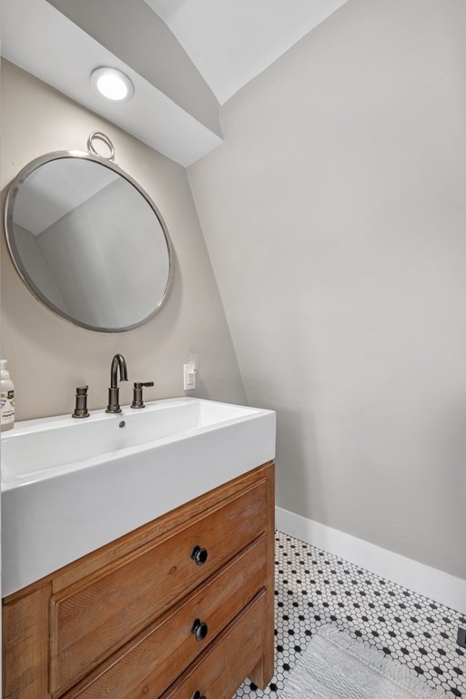 3 State Street Marblehead, MA 01945 - Photo 22 of 33 a bathroom with a sink a vanity and a mirror