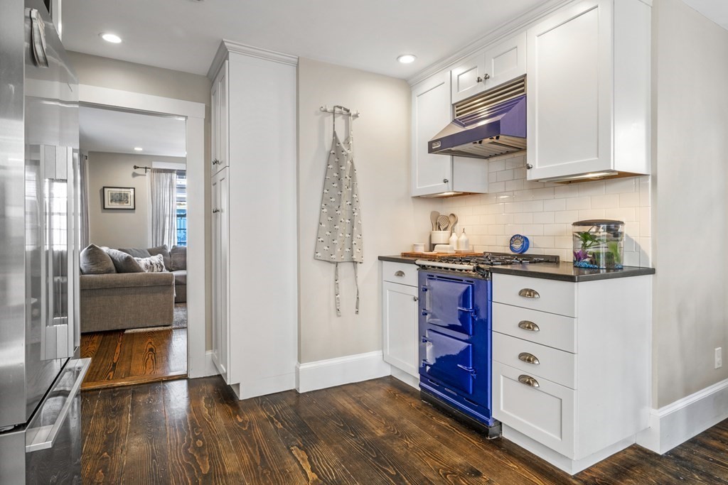 3 State Street Marblehead, MA 01945 - Photo 4 of 33 a kitchen with stainless steel appliances granite countertop a refrigerator and a stove top oven