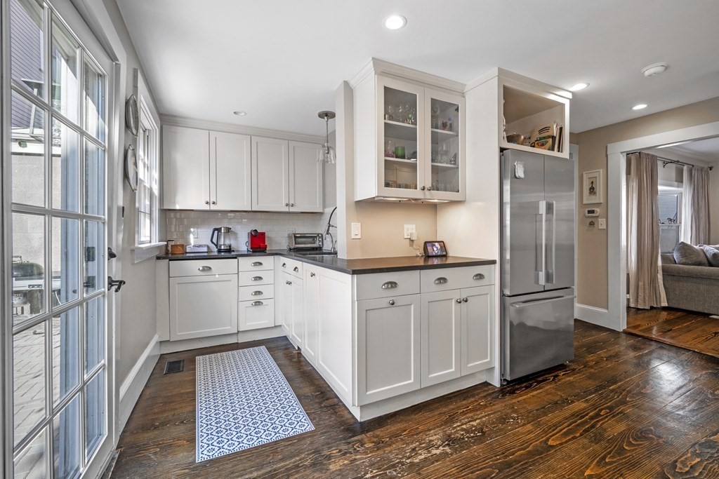3 State Street Marblehead, MA 01945 - Photo 6 of 33 a kitchen with stainless steel appliances granite countertop a refrigerator and a stove top oven