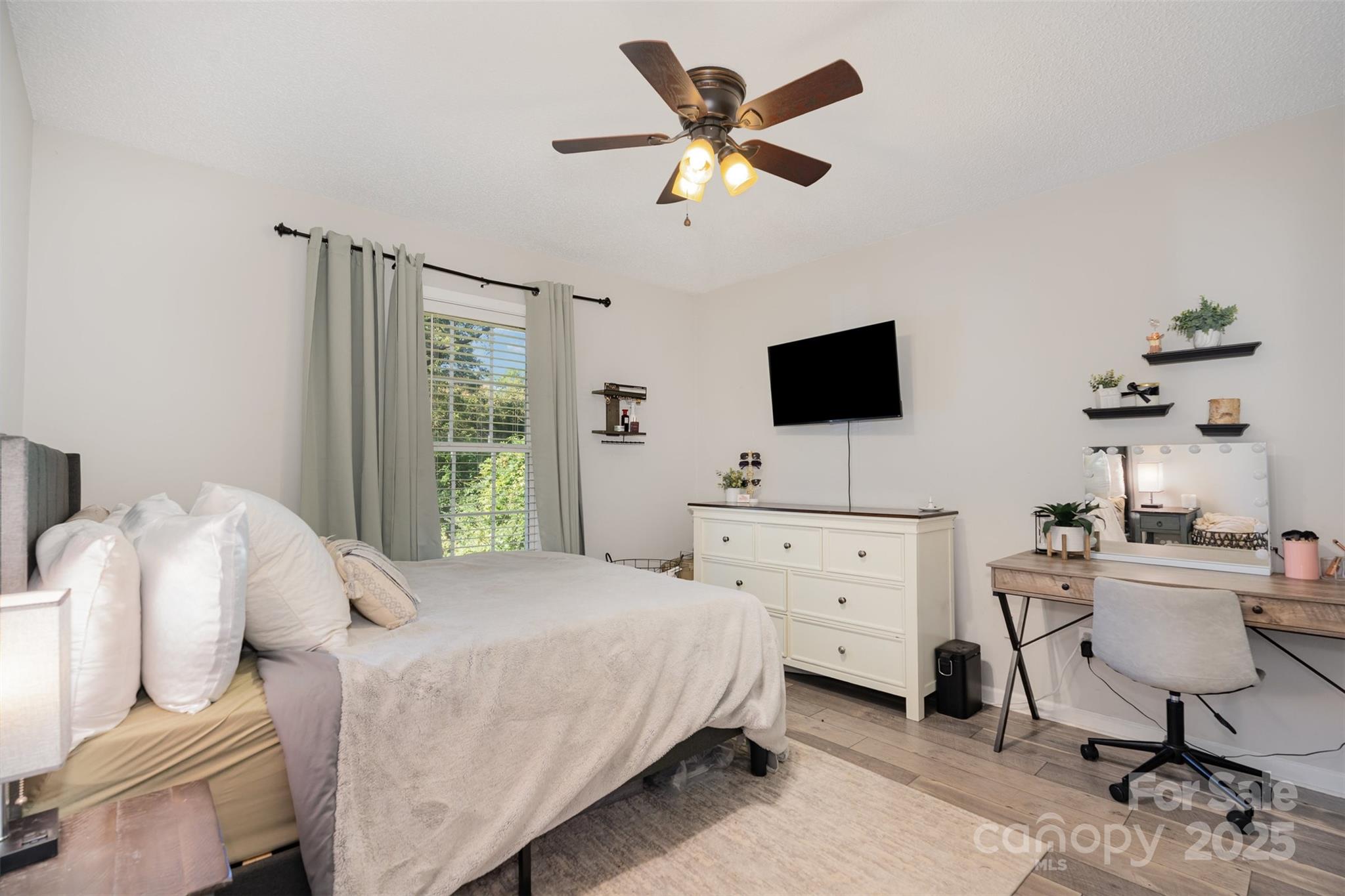 809 Fargo Drive Southwest Concord, NC 28027 - Photo 14 of 24 a bedroom with a bed and a flat screen tv