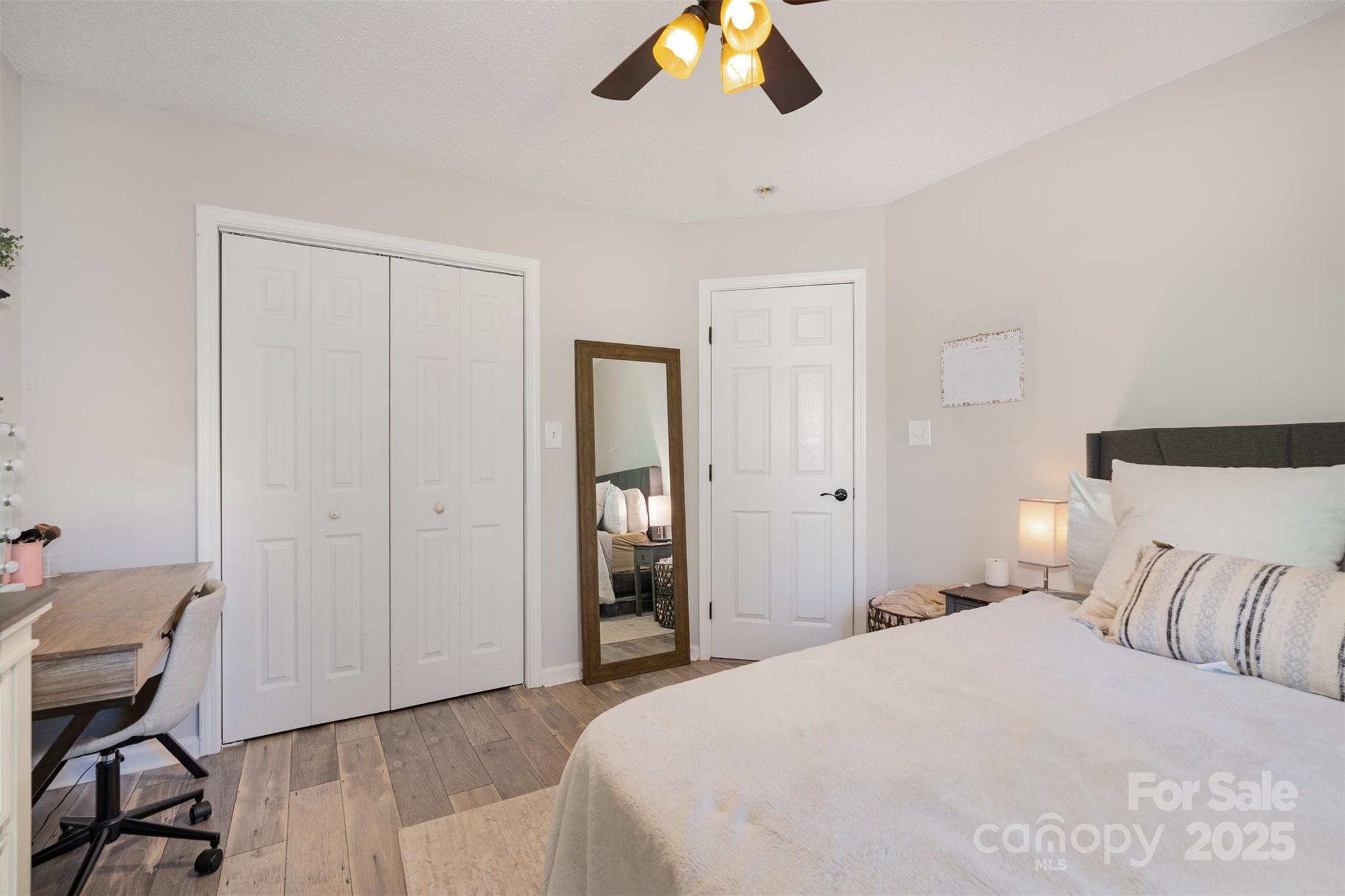 809 Fargo Drive Southwest Concord, NC 28027 - Photo 15 of 24 a bedroom with a bed and a chandelier