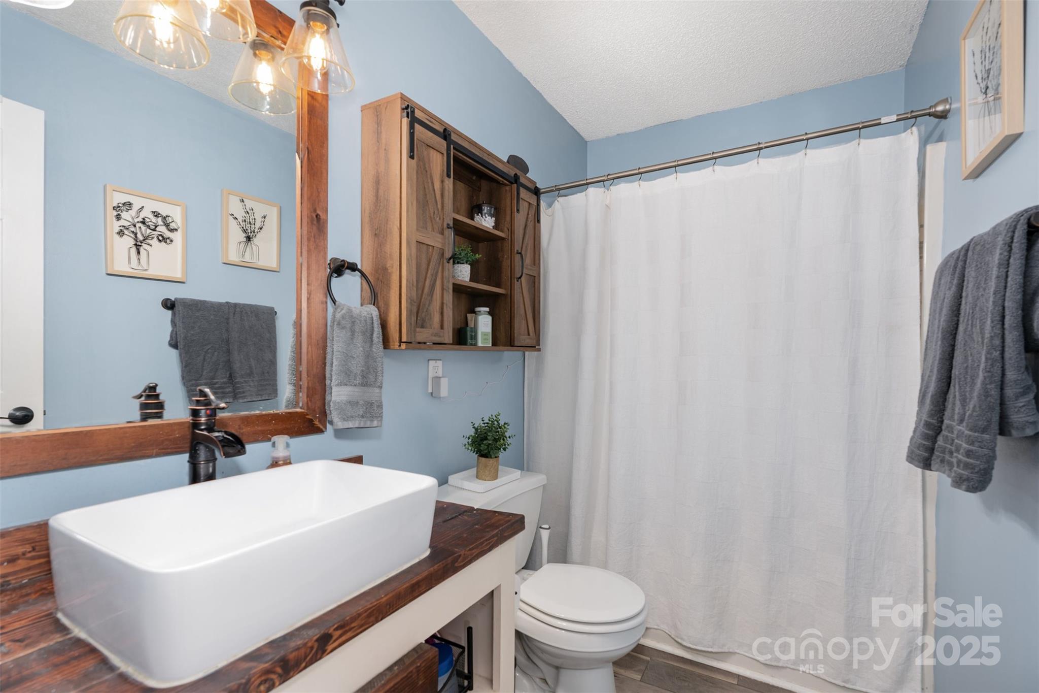 809 Fargo Drive Southwest Concord, NC 28027 - Photo 18 of 24 a bathroom with a sink toilet and shower