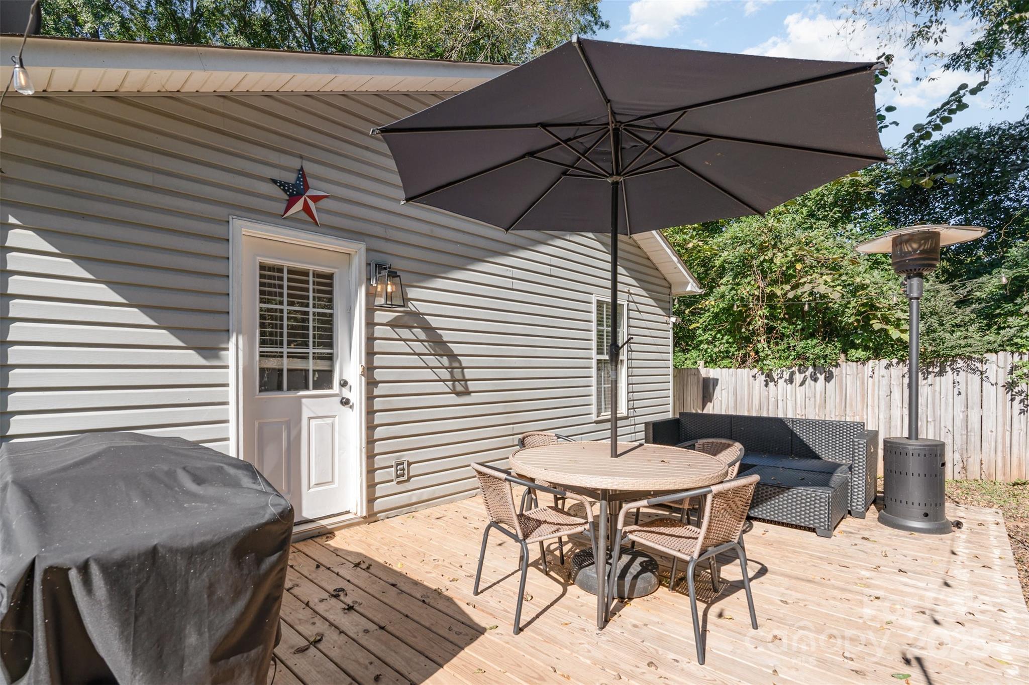 809 Fargo Drive Southwest Concord, NC 28027 - Photo 20 of 24 a patio with a patio table and chairs
