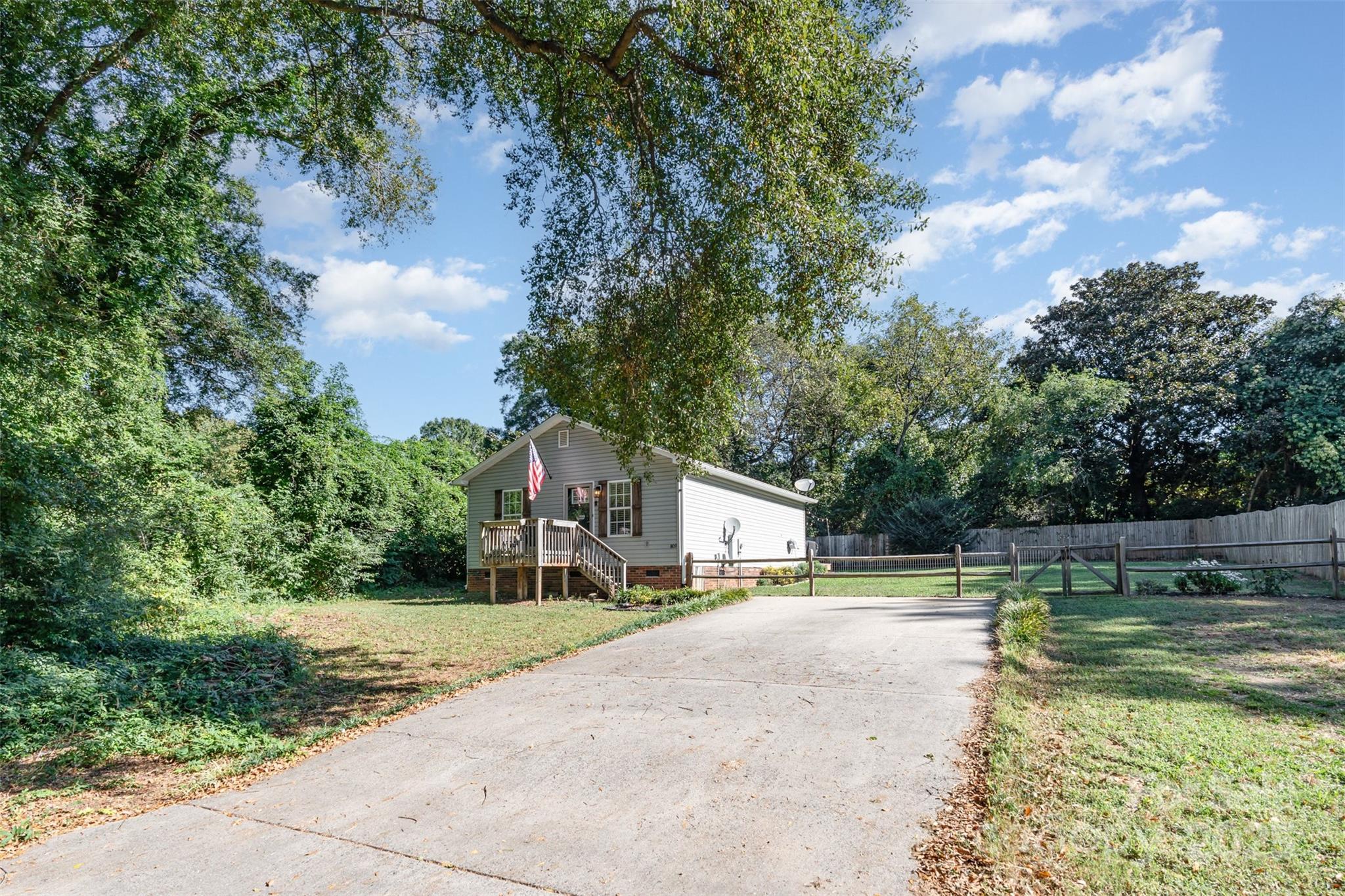 809 Fargo Drive Southwest Concord, NC 28027 - Photo 4 of 24 a view of a house with swimming pool and a yard