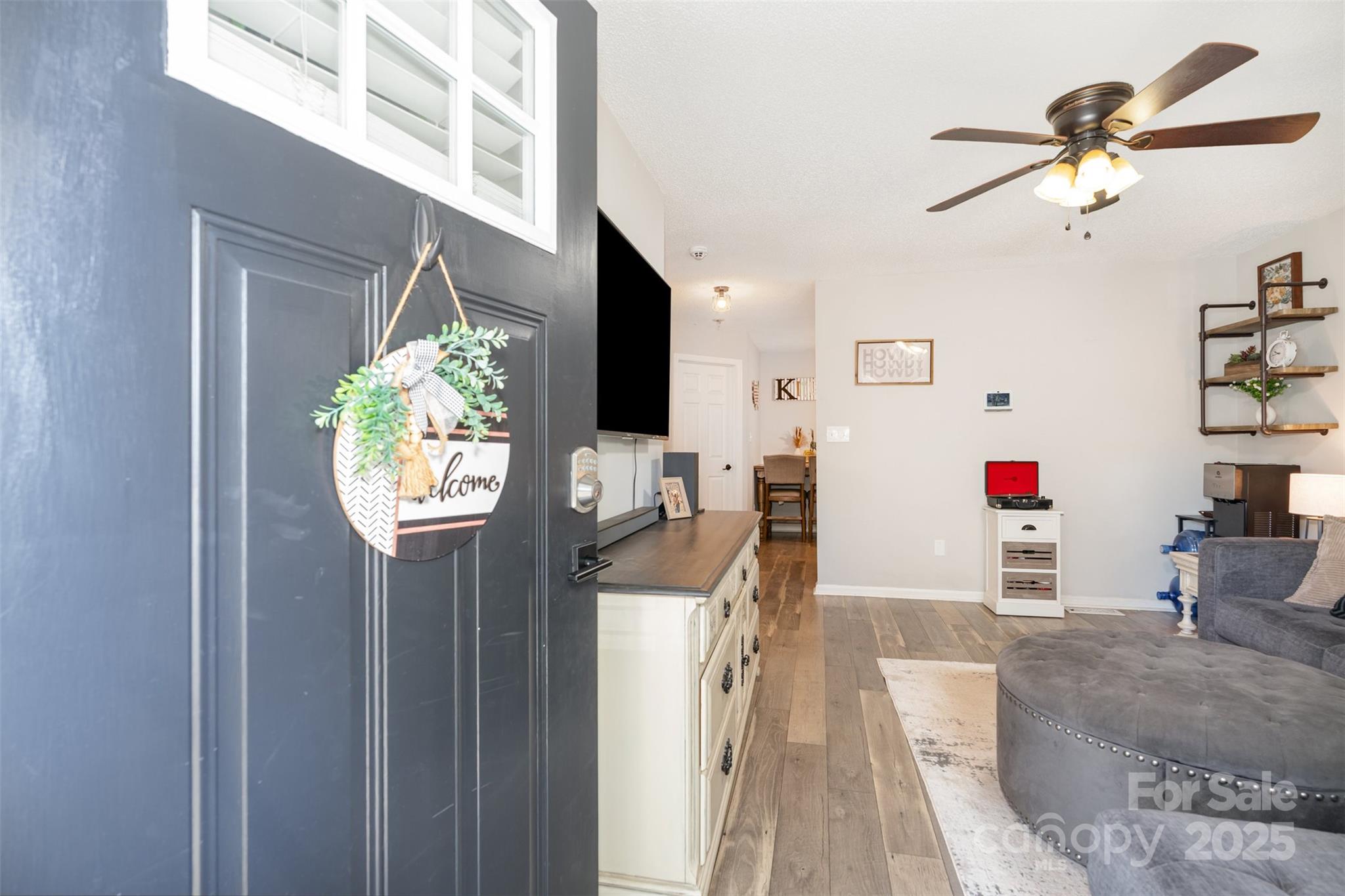 809 Fargo Drive Southwest Concord, NC 28027 - Photo 6 of 24 a living room with furniture and a flat screen tv
