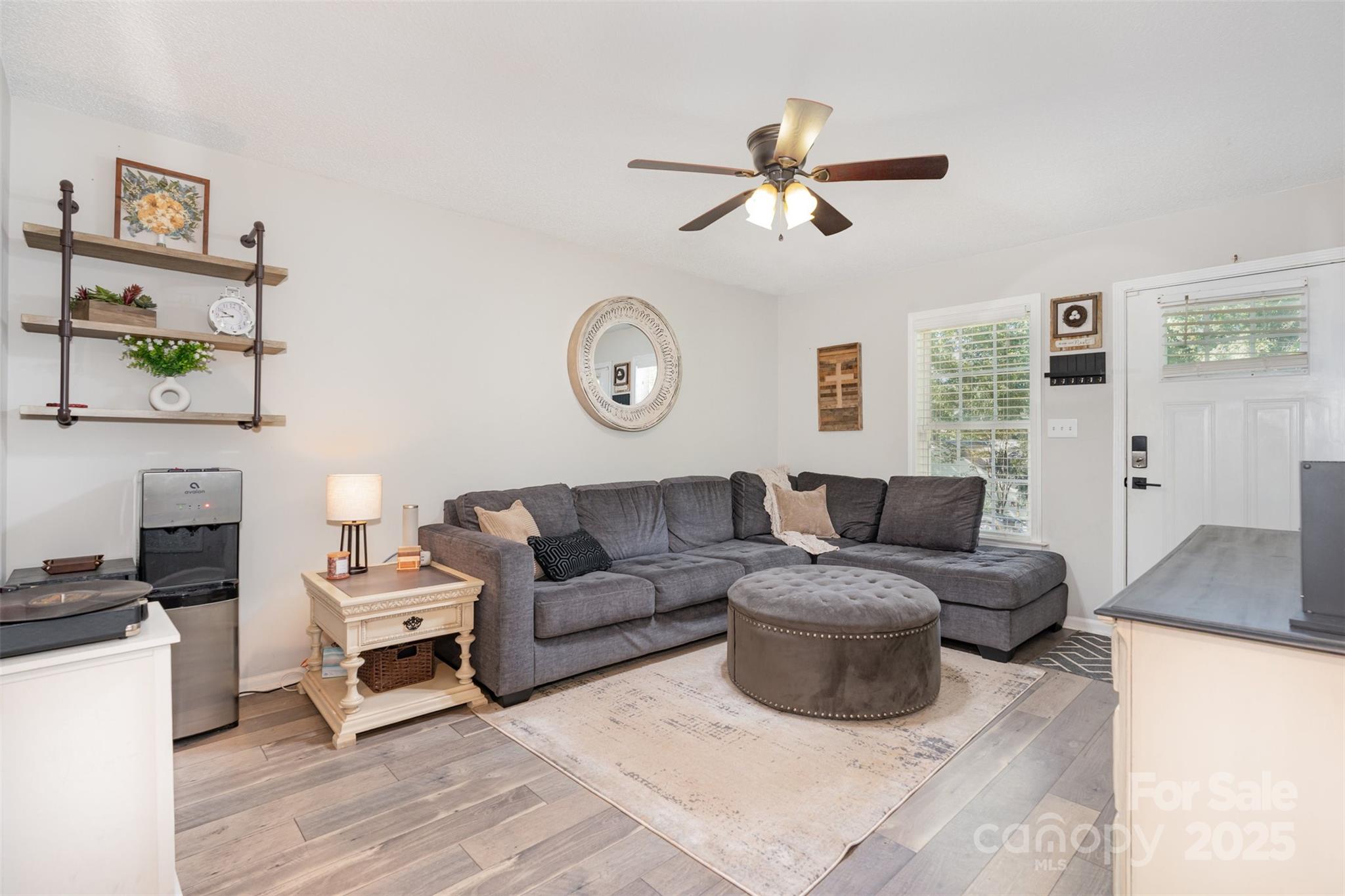 809 Fargo Drive Southwest Concord, NC 28027 - Photo 10 of 24 a living room with furniture and a flat screen tv