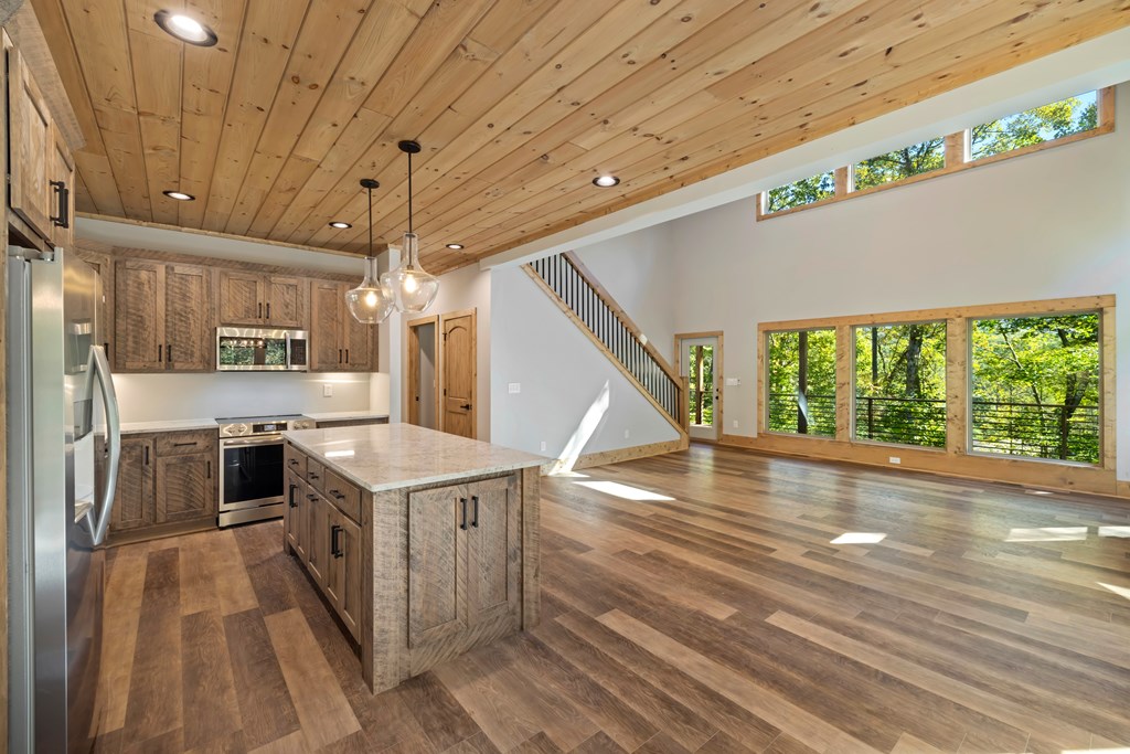 78 Pocola Court Ellijay, GA 30540 - Photo 13 of 47 a open kitchen with a stove a sink and a refrigerator