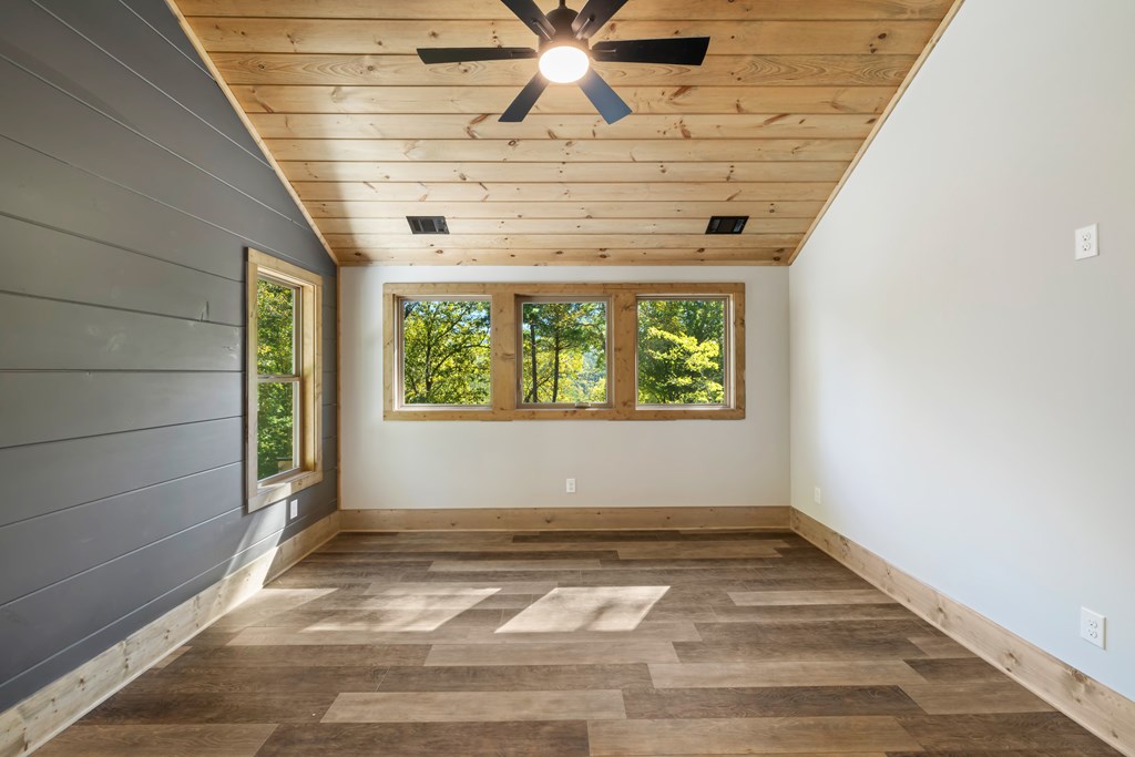 78 Pocola Court Ellijay, GA 30540 - Photo 18 of 47 an empty room with wooden floor and windows