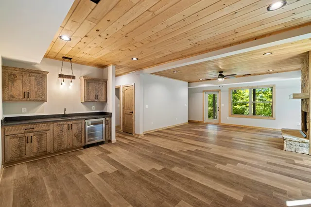 a spacious bathroom with a granite countertop sink and a large window