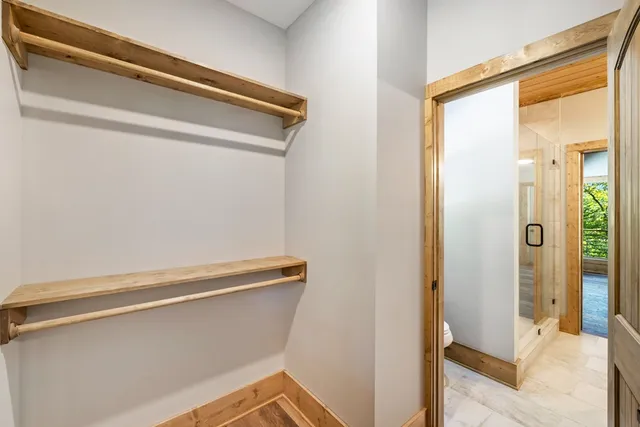 a view of a room with wooden floor