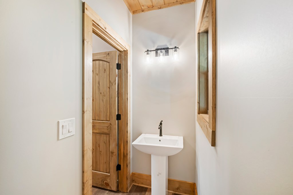 78 Pocola Court Ellijay, GA 30540 - Photo 31 of 47 a bathroom with a sink and mirror